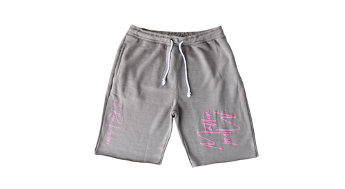 Gray shorts with pink text on a white background
