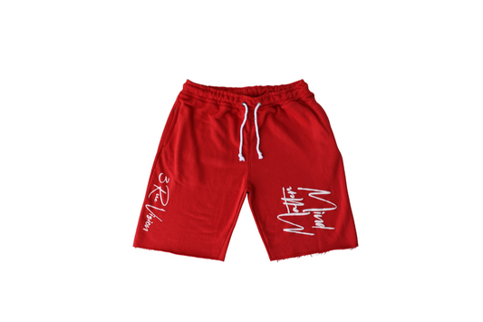 Red shorts with white text on a white background