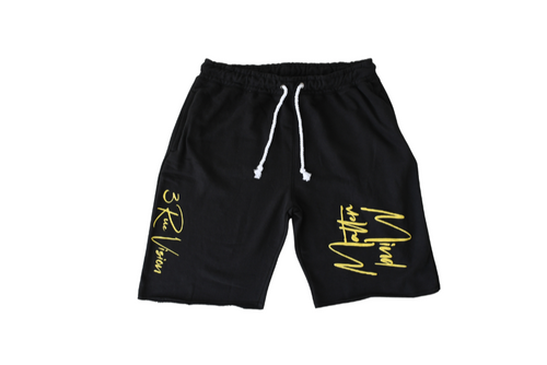 Black shorts with yellow text on a white background