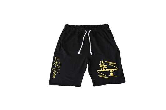 Black shorts with yellow text on a white background