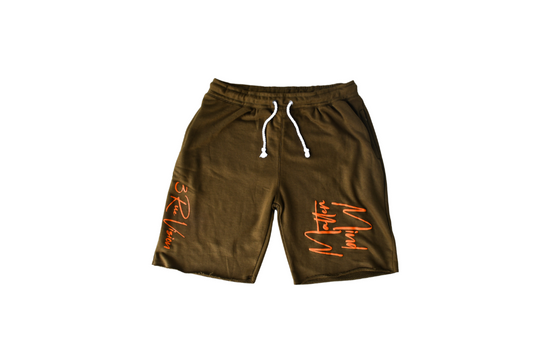 Green shorts with orange text on a white background