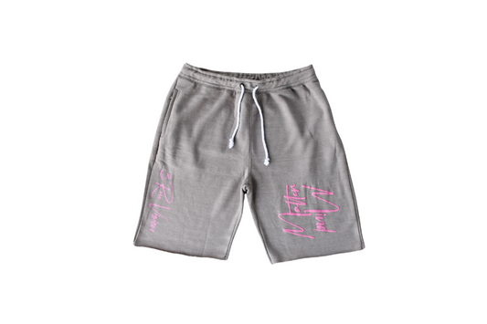 Gray shorts with pink text on a white background