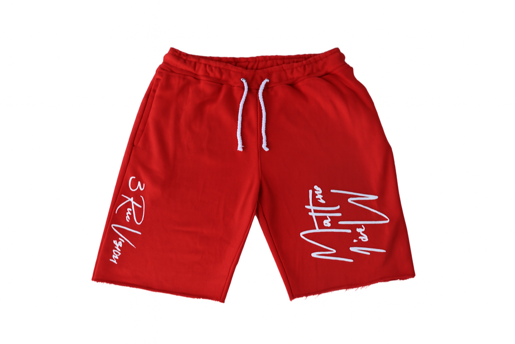 Red shorts with white text on a white background