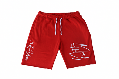 Red shorts with white text on a white background